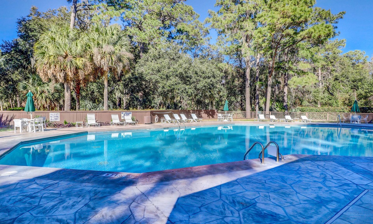 Sea Pines Condo | Beautiful villa with deck & shared pool, hot tub, tennis courts, sauna & more