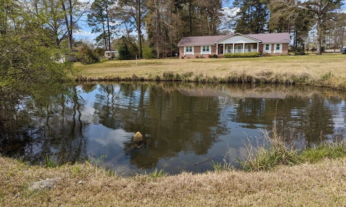 Dublin House | Charming 3-bedroom, 2-bath house with lovely Koi pond located in Dublin, GA