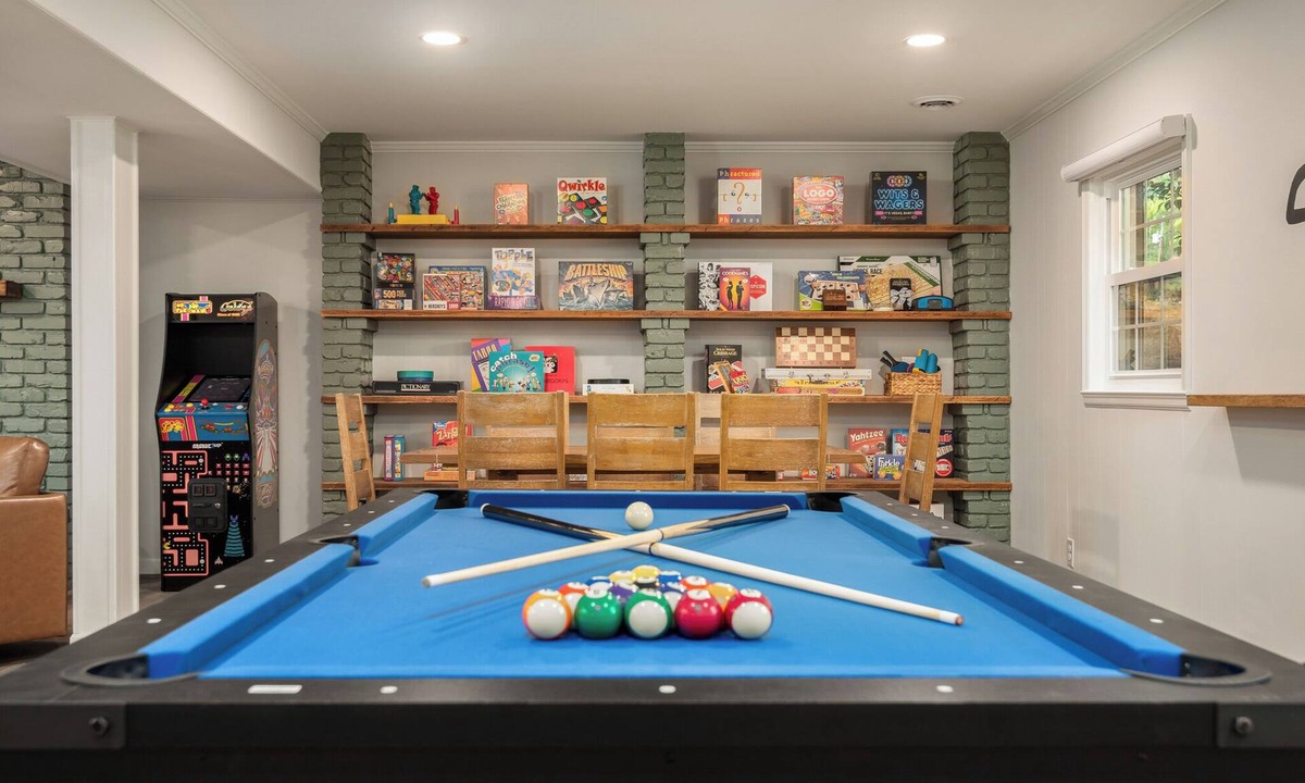Northwest Raleigh House | Experience an elevated group getaway in this renovated 3,100 sqft, 5-bdrm 3 bth. Perfect for families, it features a massive 900 sqft game room with a pool ping pong table, wet bar, & much more. Enjoy a luxurious stay with hotel-style amenities.