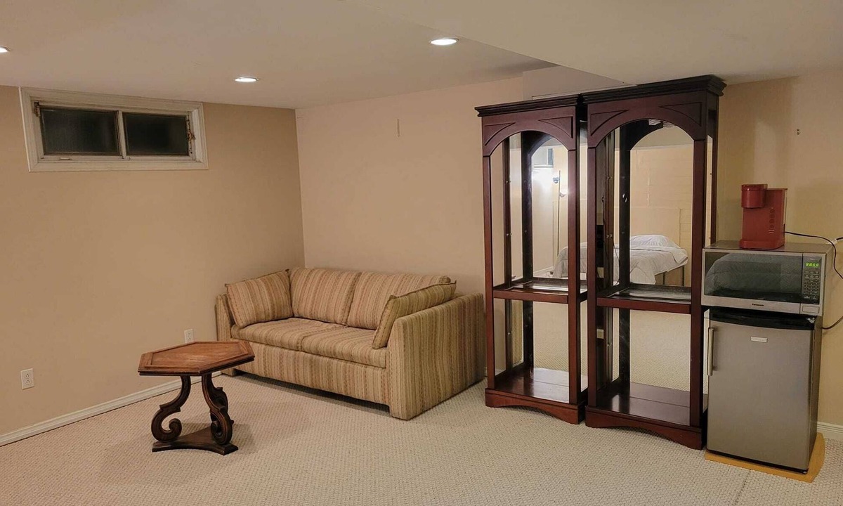 Saint-Laurent House | Spacious basement with indoor garage