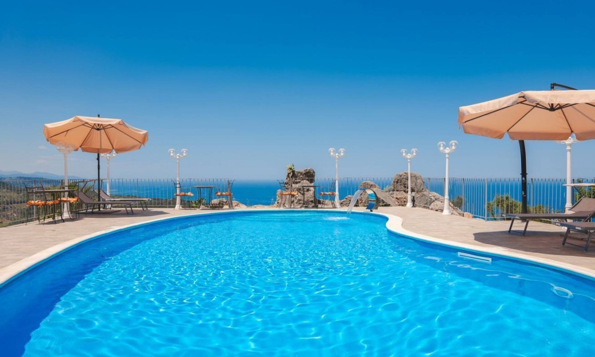 Acquedolci Villa | Villa Caterina is situated on a rock and surrounded by extensive countryside. Wooden ceilings, stone walls and antique Sicilian decorations define the character of this impressive villa.The villa consists of a large living room with a fireplace, a spacio