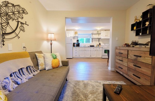 Departure Bay Apartment | A bright and cozy 1-bedroom basement suite is nestled in a lush garden setting