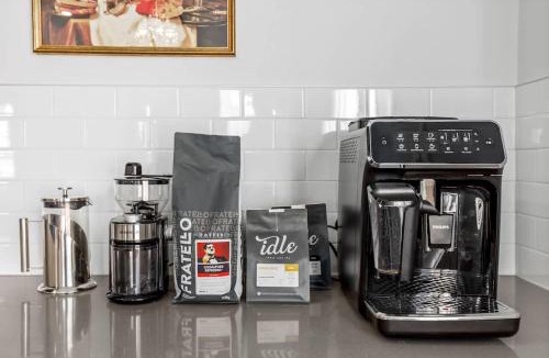 Airdrie House | Arcade King Bed Espresso Maker Family Friendly