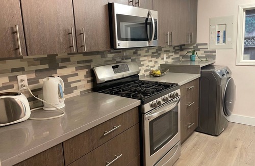 Upper Lonsdale Apartment | Big modern one-bedroom suite, full kitchen, mins away from ski resort, trails.