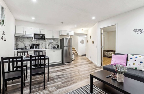 Cranston House | Charming Basement Suite with Parking & Laundry
