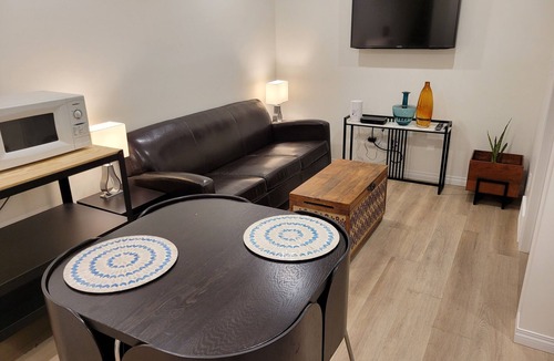 Southeast Calgary House | Cozy basement unit near restaurants, bars, stores, bus stations, and hospital.