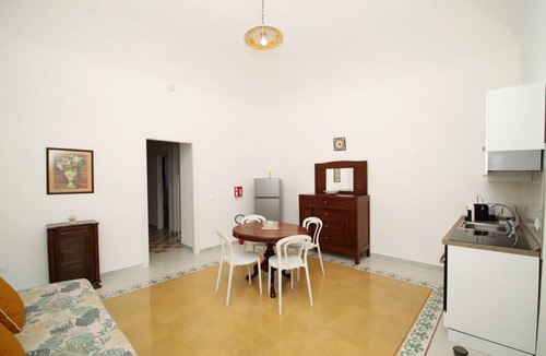 Marina di Caronia Apartment | Dimora Burrafato, known by locals as “La Casa Rossa”, is a historic summer residence once owned by Princess Pignatelli, located directly on the seafront of Caronia. The property consists of three independent units, each with a private entrance, a bal