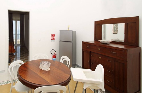 Marina di Caronia Apartment | Dimora Burrafato, known by locals as “La Casa Rossa”, is a historic summer residence once owned by Princess Pignatelli, located directly on the seafront of Caronia. The property consists of three independent units, each with a private entrance, a bal