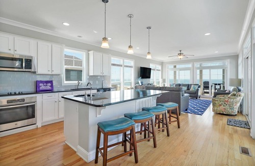 Long Beach House | Discover oceanfront bliss at 7th Heaven in Oak Island, NC—spacious 7BR, sleeps 24!