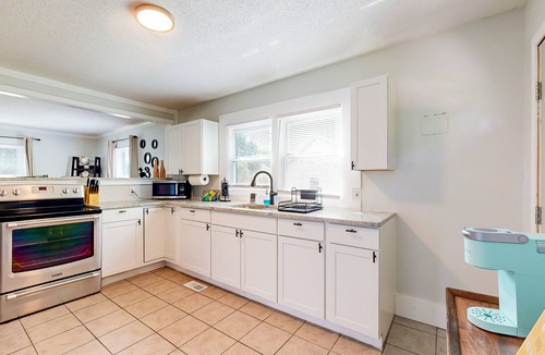 Burlington House | Dog-friendly spacious home near lake & town with fireplace & private backyard