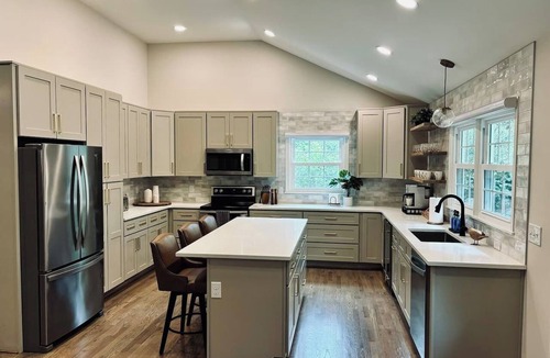 Northwest Raleigh House | Experience an elevated group getaway in this renovated 3,100 sqft, 5-bdrm 3 bth. Perfect for families, it features a massive 900 sqft game room with a pool ping pong table, wet bar, & much more. Enjoy a luxurious stay with hotel-style amenities.