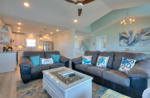 Long Beach House | Experience oceanfront bliss at Blue Yonder, a spacious 4-bedroom retreat in Oak Island.