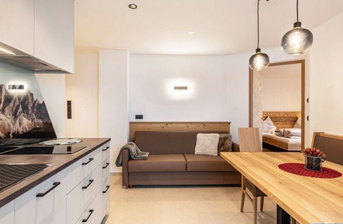 Funes Apartment | Holiday Apartment "Planerhof Apartment Lilie" with Mountain View, Shared Terrace and Wi-Fi