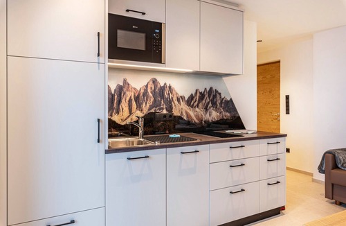 Funes Apartment | Holiday Apartment "Planerhof Apartment Lilie" with Mountain View, Shared Terrace and Wi-Fi