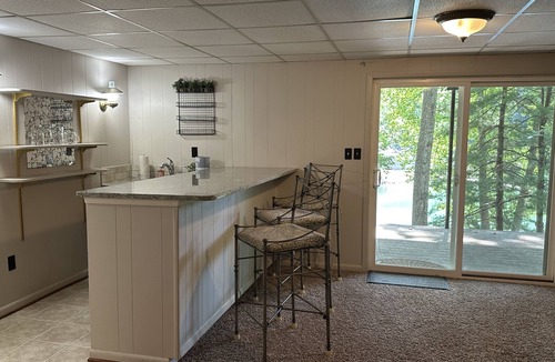High Point House | Humble Hideaway - Inviting lakefront home with firepit, balcony & W/D - dog-friendly