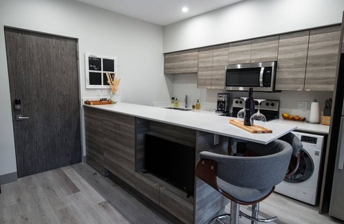 Vernon Apartment | Lake Okanagan beach condo w/private buoy, AC, heated outdoor pool, patio, SUPs