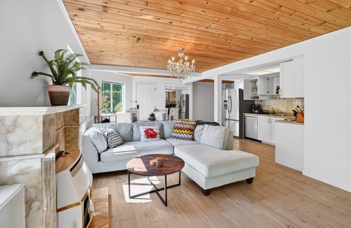 Upper Lonsdale House | Large fully renovated 2-bedroom ground-level suite with a fenced backyard