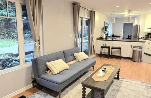 Upper Lonsdale House | Master bedroom with en-suite bathroom, and a shared kitchen and living room