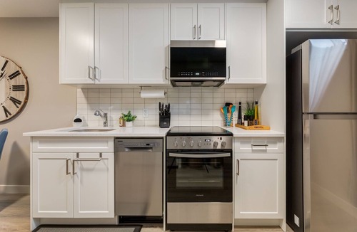 Southeast Calgary House | Newly Built Suite | Central Kitchen Laundry Soaktub Workspace