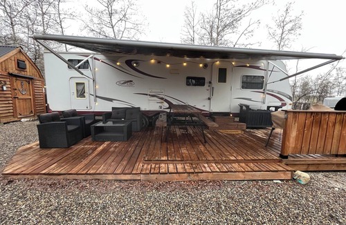 Mountain View House | Payne Lake Wilderness Huts - Camper A18 A cozy camper near a quiet lake!