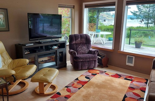 Heriot Bay Apartment | Perfect getaway. Spectacular mountain and ocean view. Steps to the beach.