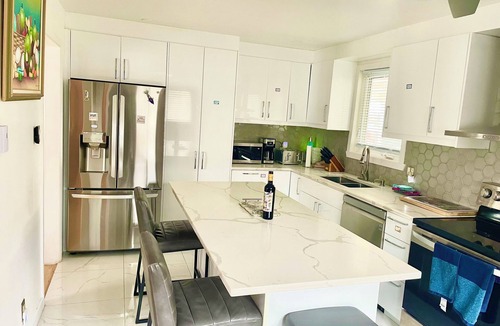 Sainte-Dorothee Apartment | Spacious Zen Floor in Laval - Private Heated & Salt Pool, Garden & Piano