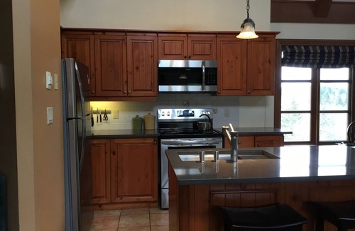 Mont-Tremblant Condo | Tremblant, ski in/out, 4 bedroom, sleeps 8, big pool, 2 decks + fire pit + pond
