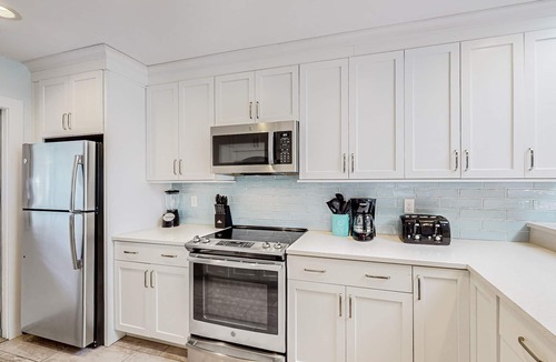 Sea Pines Condo | Updated, waterfront condo with amazing lagoon & golf views from the sunroom