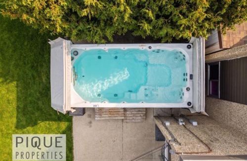 Northeast Edmonton Apartment | Urban Oasis - with 16ft Swim Spa - Heated Hot Tub & Pool