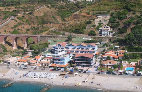 Province of Messina House | Vacation Home "Oasi Azzurra - Bilocale Standard-102" with Shared Pool & 2 Shared Terraces