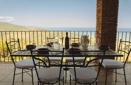Acquedolci Villa | Villa Caterina is situated on a rock and surrounded by extensive countryside. Wooden ceilings, stone walls and antique Sicilian decorations define the character of this impressive villa.The villa consists of a large living room with a fireplace, a spacio