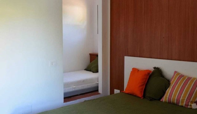 A delightful section of a villa surrounded by greenery and just a stone's throw from the sea