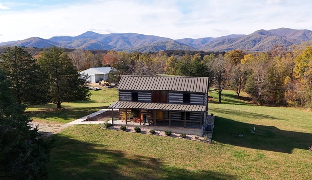 Charming, fully renovated 19th century cabin with spectacular views. 4 BR, 2 BA.