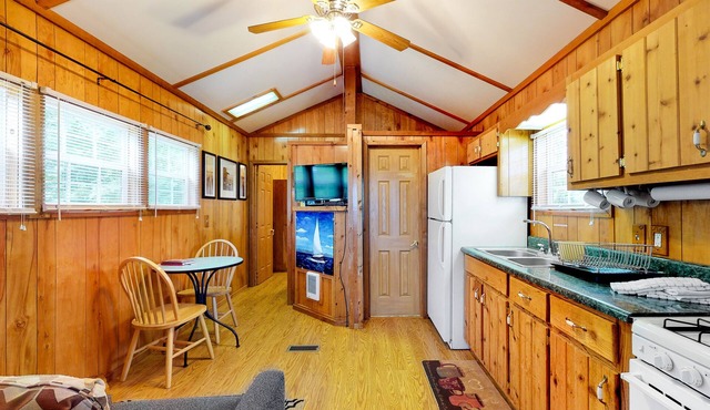 Charming lakefront cabin on two acres with dock & firepit
