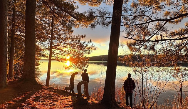Charming lakefront cottage with private dock, stunning sunsets & cozy wood stove