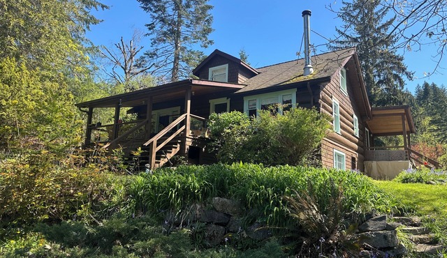 Charming Log Home on acreage bordering golf course with full gym