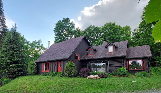 Charming spacious rustic Chalet with view minutes away from major ski centers .