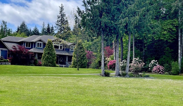 Country Estate on acreage with swimming pool, hot tub, creek and trails.