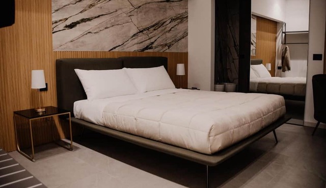 Deluxe Suite with Balcony, Wi-Fi, and Air Conditioning