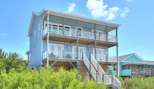Experience oceanfront bliss at Blue Yonder, a spacious 4-bedroom retreat in Oak Island.