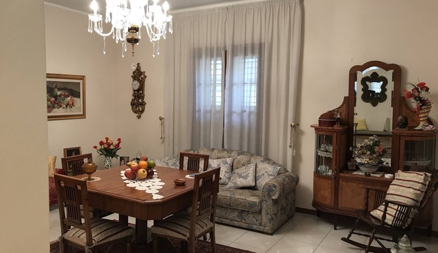 Fausto's house is an apartment on the first floor of a two-storey building.