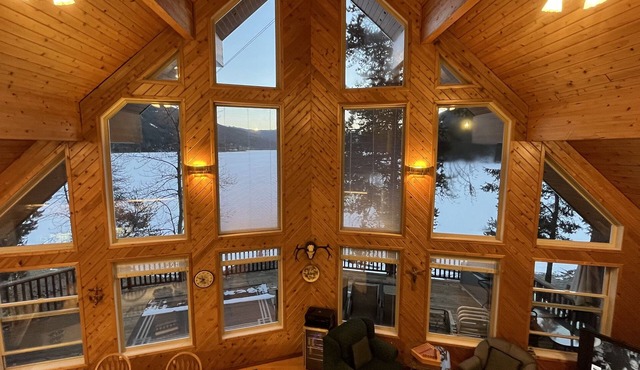 High-end three-level 3,000 sq ft home boasts 150 ft of private beachfront.