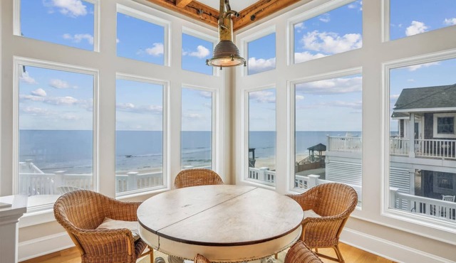 Oceanfront 8BR Corolla retreat with pool, hot tub, and beach access.