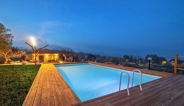 Panorama of Etna and sea, nestled in the park, swimming pool