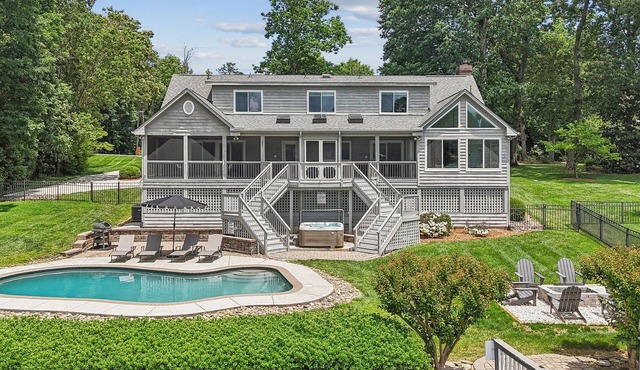 Private Waterfront Home with heated pool, hot tub, firepit, kayaks, game room and much more!