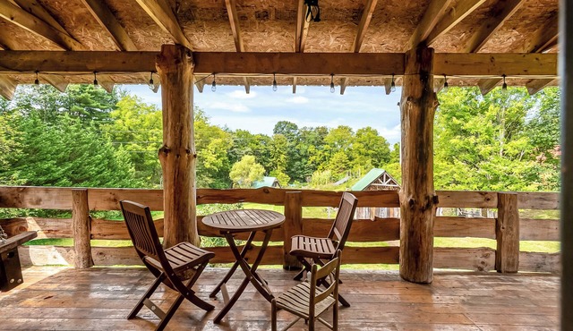 Rustic log cabin with modern comforts, scenic views, and cozy spaces for the perfect getaway.