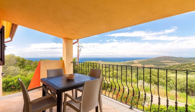 Sea View Isola Rossa Apartment with Sea View, Wi-Fi, and Air Conditioning