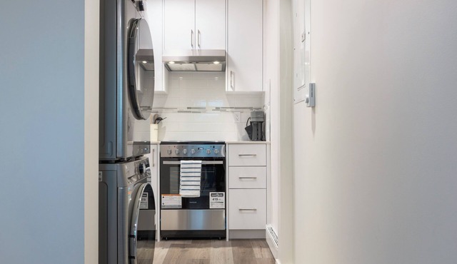 Soothing 1-bedroom condo with AC in vibrant Vancouver