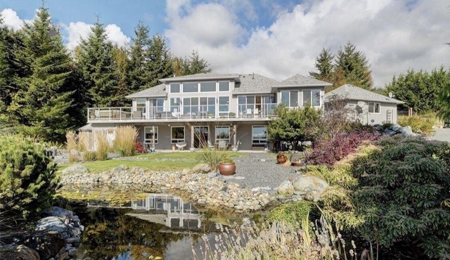 Stunning open style home set on 3 acres in the Seaside hamlet of Jordan River.