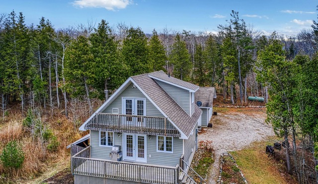 Waterfront, chalet style home; minutes walk to the beach